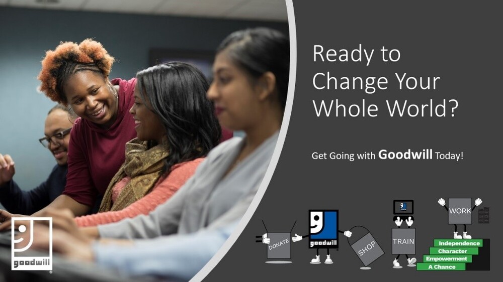 3 women at computers being helped by a smiling woman