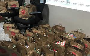 Brown paper bags with snacks and other items inside.