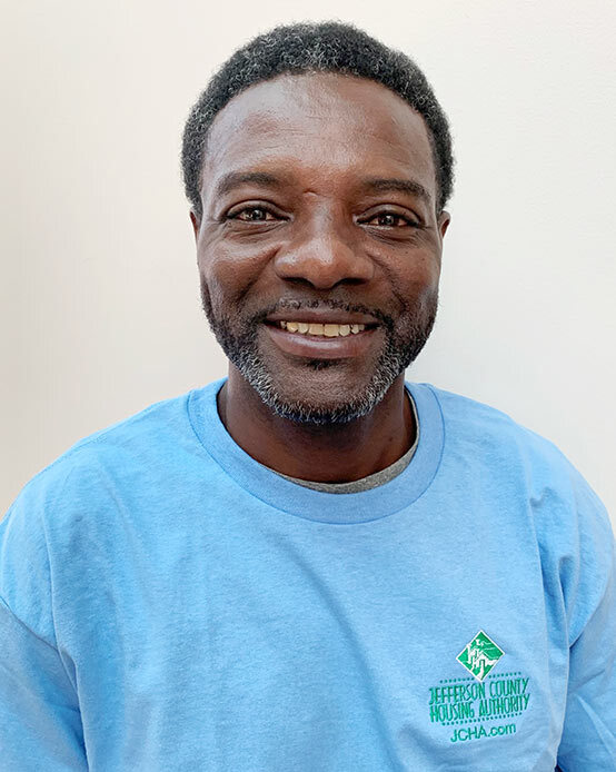 Bruce Mitchell smiles for his headshot.