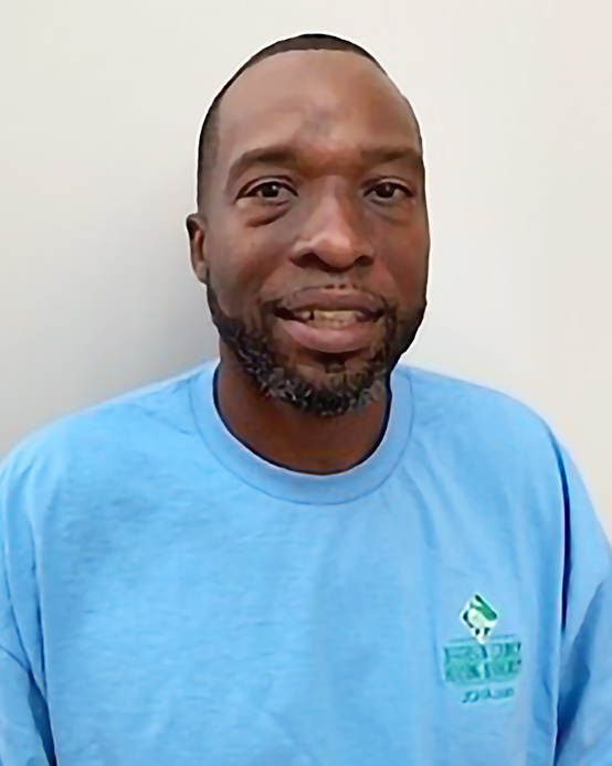 Farrish Hayes smiles for his headshot.