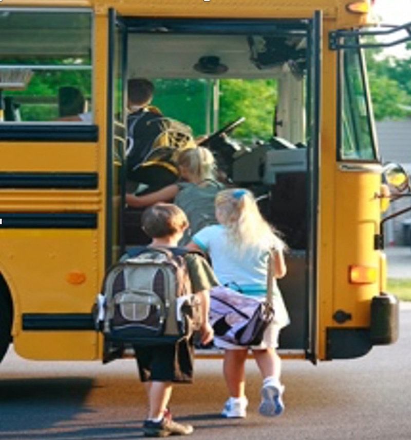 Children entering a school bus.