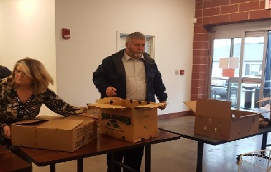 Volunteers preparing to take boxes to the Food Bank